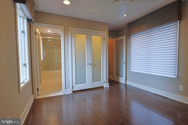 unfurnished bedroom featuring recessed lighting, visible vents, baseboards, and dark wood-type flooring