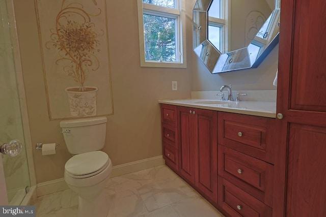 full bathroom featuring baseboards, toilet, marble finish floor, and vanity