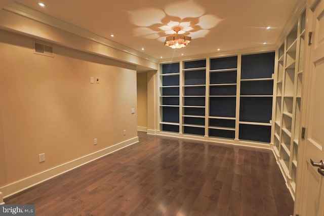 unfurnished room featuring wood finished floors, visible vents, baseboards, recessed lighting, and crown molding