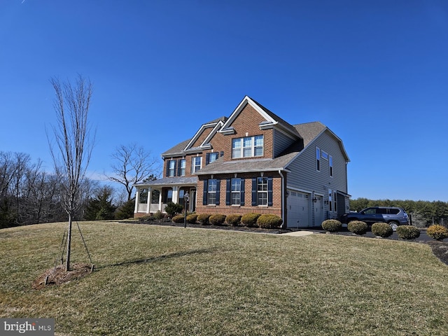 view of front facade with brick siding, a garage, and a front lawn