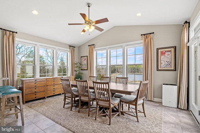 dining area with light tile patterned floors, baseboards, lofted ceiling, recessed lighting, and ceiling fan