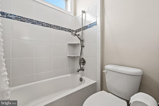 bathroom featuring toilet and washtub / shower combination