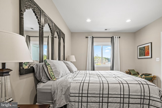 bedroom with recessed lighting and visible vents