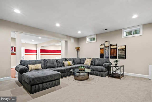 carpeted living room featuring visible vents, recessed lighting, baseboards, and ornate columns