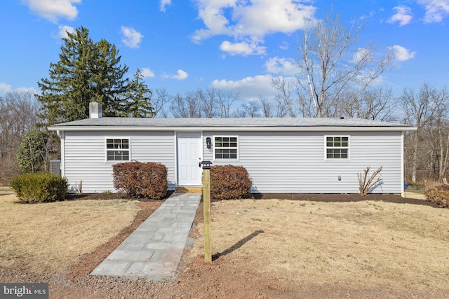 exterior space with a front lawn