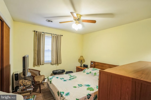 bedroom featuring a closet, visible vents, and a ceiling fan