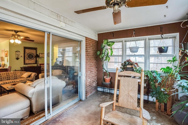 sunroom / solarium with ceiling fan