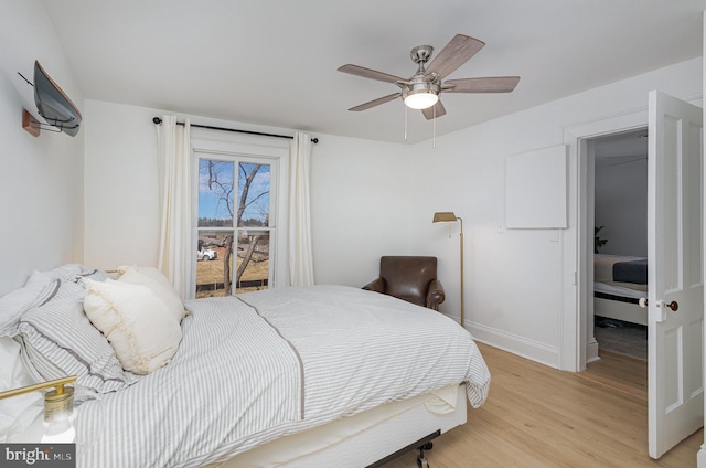 bedroom with baseboards, a ceiling fan, and light wood finished floors