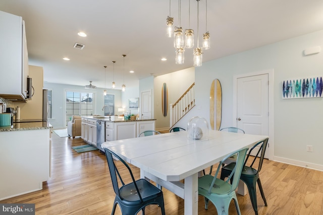 dining area with recessed lighting, visible vents, baseboards, stairs, and light wood-style floors