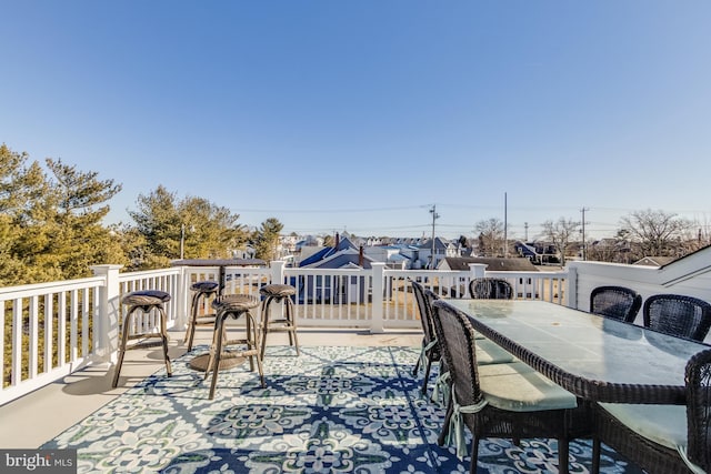 wooden deck featuring outdoor dining area