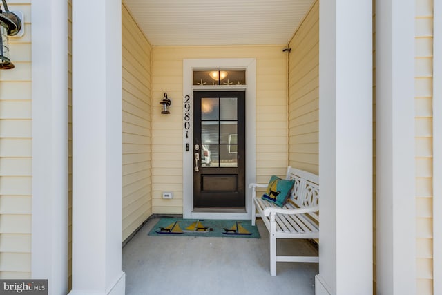 doorway to property featuring a porch