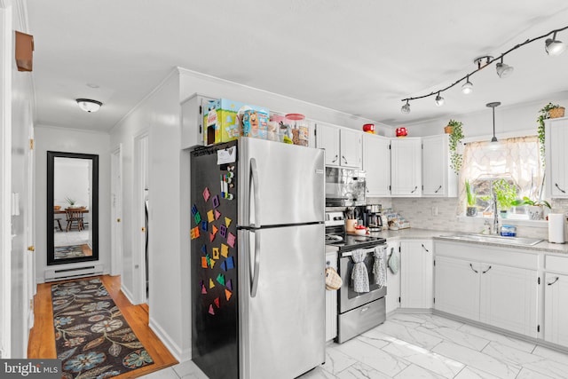 kitchen featuring light countertops, decorative backsplash, stainless steel appliances, white cabinetry, and a sink