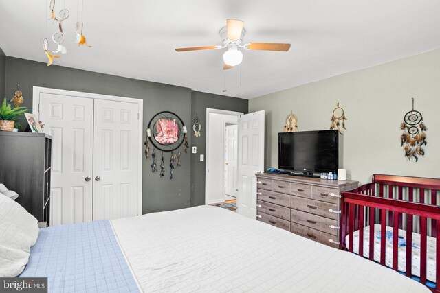 bedroom with a closet and a ceiling fan