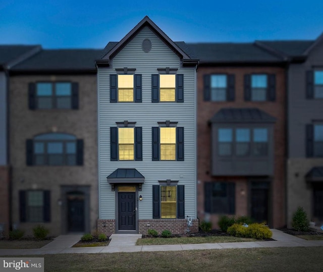 multi unit property featuring brick siding