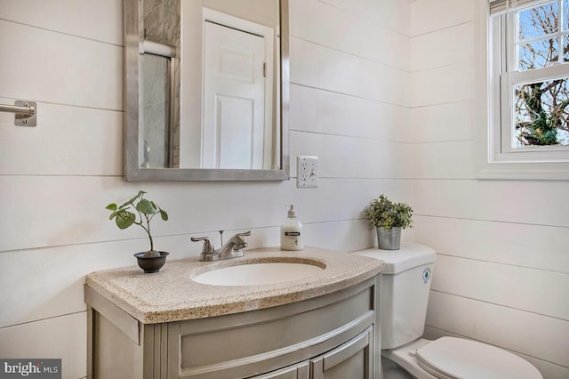 bathroom with vanity and toilet