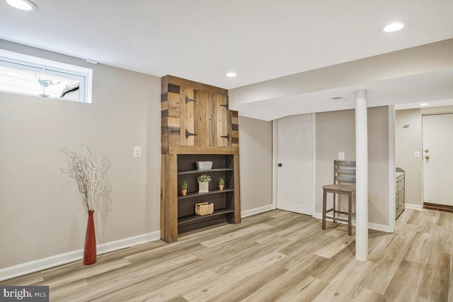 interior space featuring recessed lighting, light wood-style flooring, and baseboards