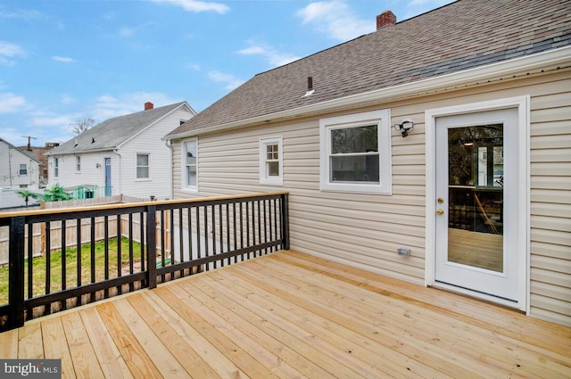 wooden deck featuring a residential view