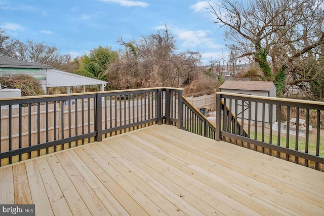 deck with fence and an outdoor structure