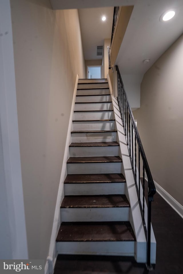 stairway featuring recessed lighting, visible vents, and baseboards