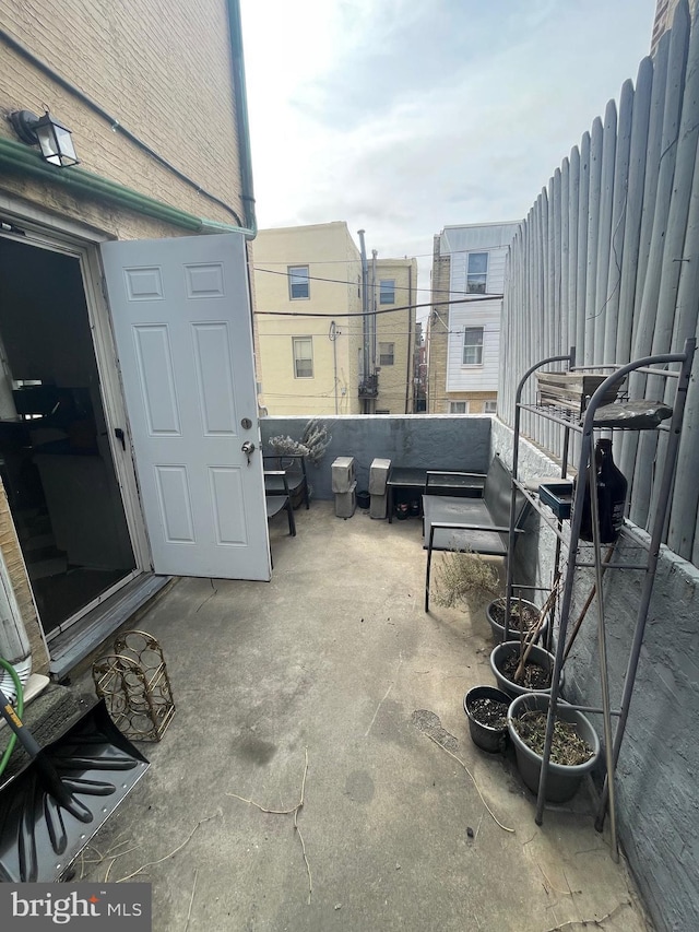 view of patio featuring a balcony