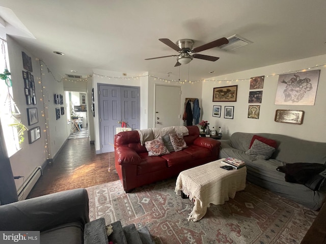 living room with visible vents, baseboards, ceiling fan, and a baseboard radiator