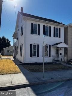 view of front of home with a chimney