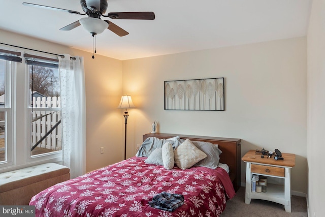 bedroom featuring a ceiling fan and carpet