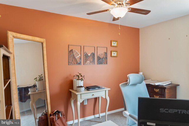 home office with baseboards, carpet, and a ceiling fan