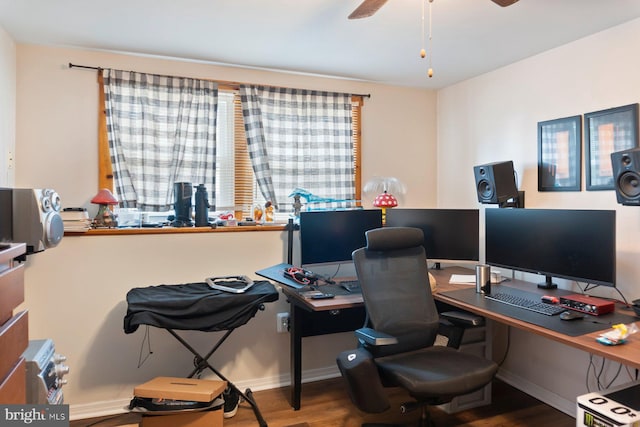 home office featuring ceiling fan, baseboards, and wood finished floors