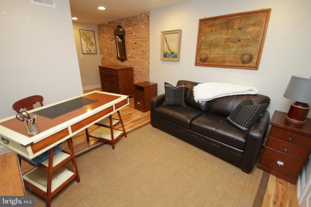 living area featuring recessed lighting and visible vents