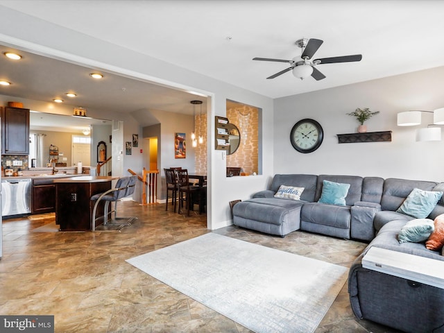 living room featuring a ceiling fan and recessed lighting