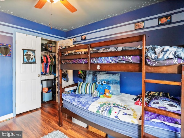 bedroom with wood finished floors