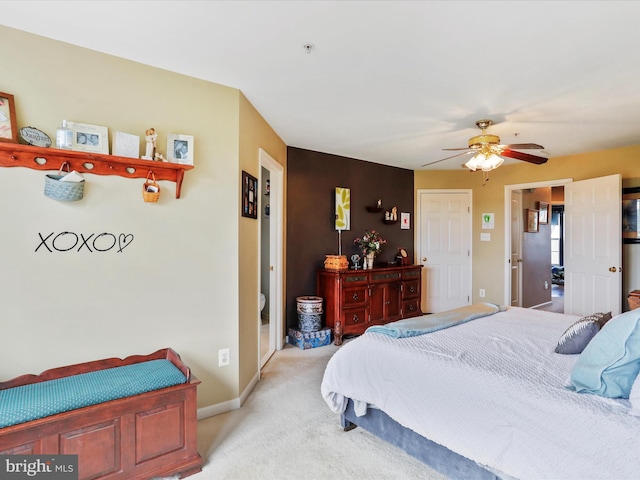 bedroom with ceiling fan, baseboards, and light colored carpet