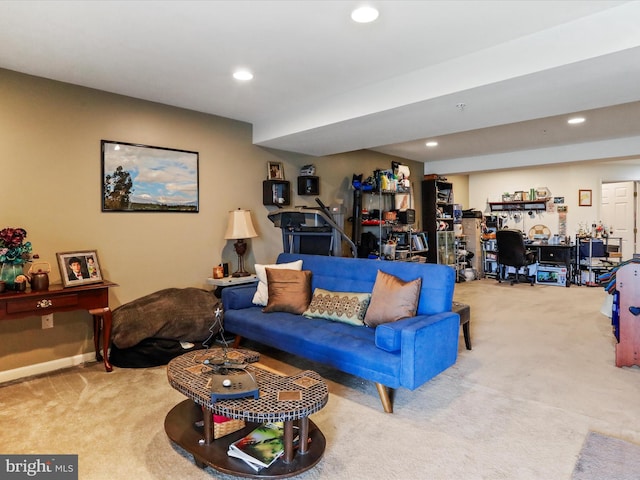 carpeted living area with baseboards and recessed lighting