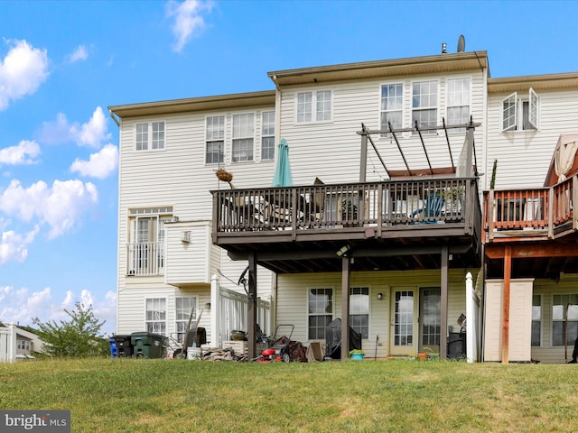 rear view of house featuring a yard