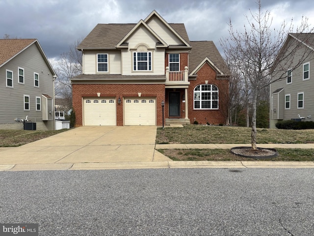 traditional home featuring cooling unit, concrete driveway, an attached garage, a shingled roof, and brick siding