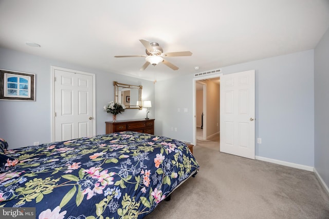 bedroom featuring ceiling fan, carpet floors, visible vents, and baseboards