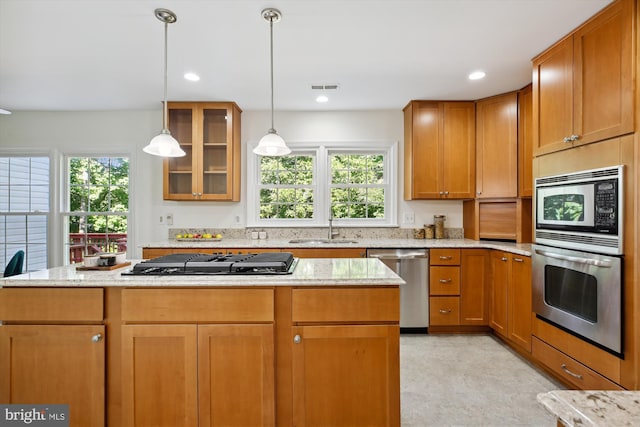 1729 Hutchinson Ln, Silver Spring, MD 20906 - kitchen with stainless steel appliances, a sink, healthy amount of natural light, a center island, and recessed lighting