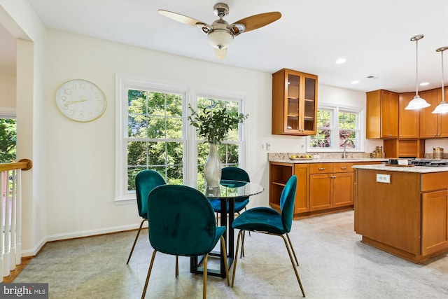 1729 Hutchinson Ln, Silver Spring, MD 20906 - kitchen featuring brown cabinetry, ceiling fan, glass insert cabinets, pendant lighting, and recessed lighting