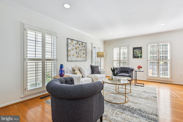 1729 Hutchinson Ln, Silver Spring, MD 20906 - living area featuring crown molding, plenty of natural light, wood finished floors, baseboards, and recessed lighting