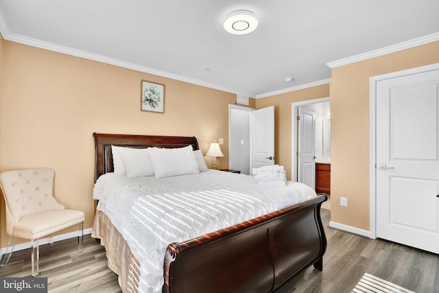 bedroom with crown molding, baseboards, and wood finished floors