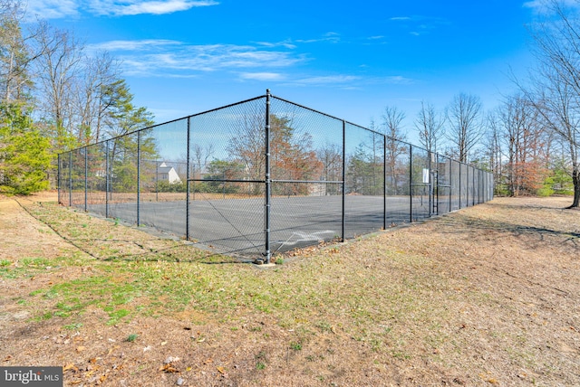 view of sport court with fence