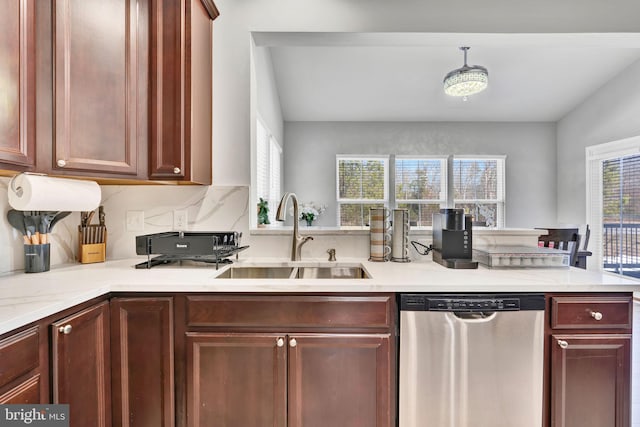 kitchen with dishwasher, tasteful backsplash, a wealth of natural light, and a sink