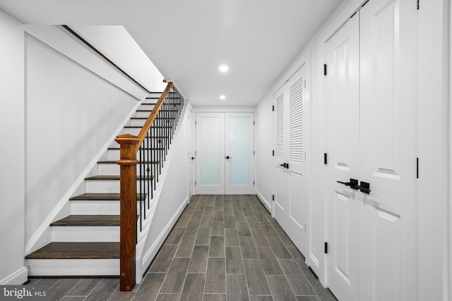 corridor featuring wood tiled floor, stairway, and recessed lighting