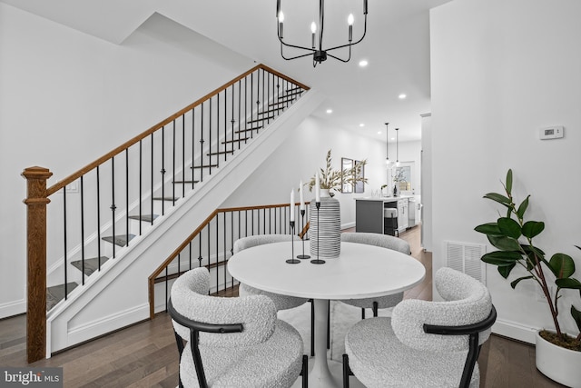 dining area with recessed lighting, visible vents, wood finished floors, baseboards, and stairs