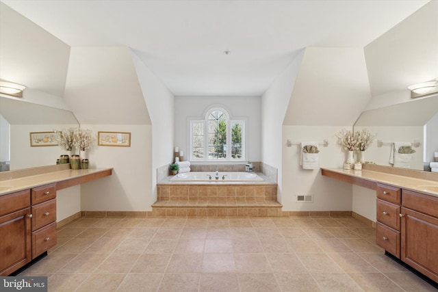 full bathroom with visible vents, baseboards, lofted ceiling, a bath, and vanity