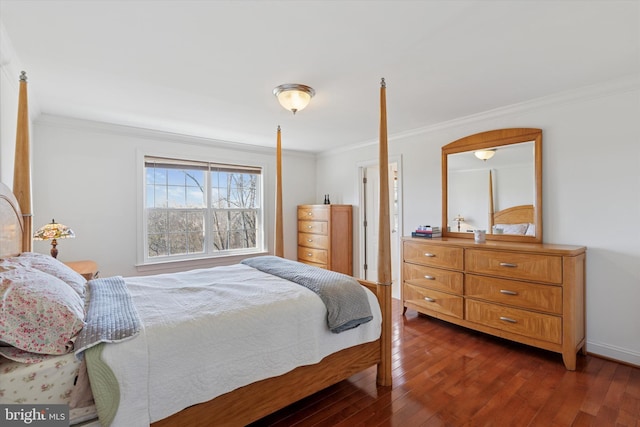 bedroom featuring dark wood-style floors, baseboards, and ornamental molding