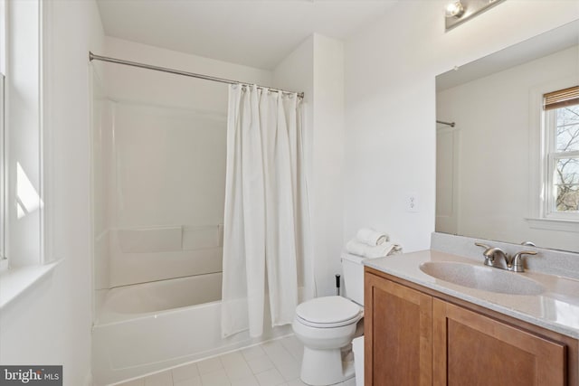 full bath with toilet, vanity, and shower / bath combo