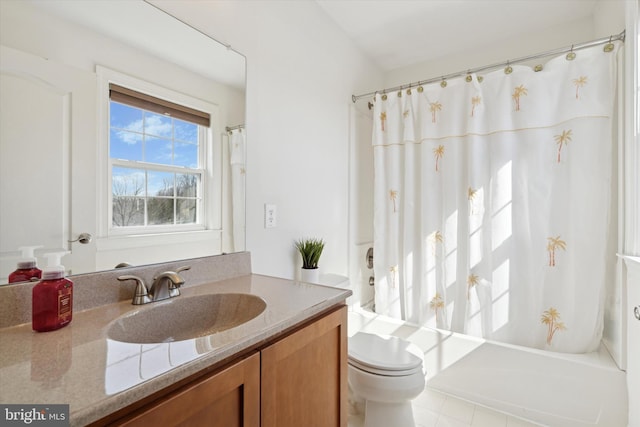 bathroom featuring vanity, a shower with shower curtain, and toilet