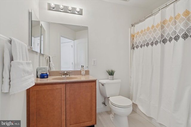 bathroom with vanity, tile patterned floors, toilet, and a shower with shower curtain